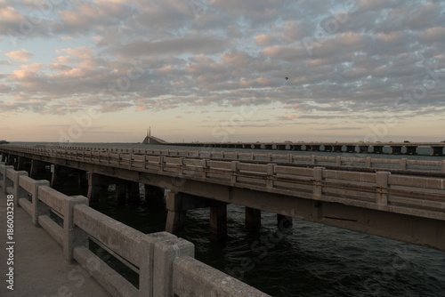 Sunset View Along Pier With Skyway Bridge in Distance