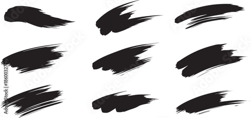 Abstract dark brush strokes on a black background, artistic design elements