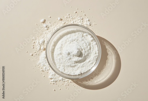A bowl of finely ground white powder on a neutral background, highlighting purity and texture. allantoin