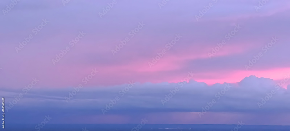 Fototapeta premium Dreamy Pastel Sunset Sky with Soft Clouds