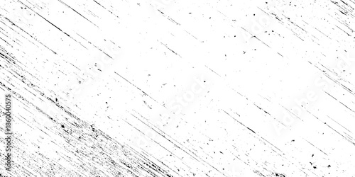 A stark abstract image presenting a dynamic arrangement of diagonal dark grey brushstrokes agepsnst a white background