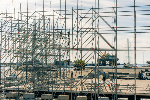 Wallpaper Mural  Scaffolding at a construction site with workers against a clear blue sky. Torontodigital.ca