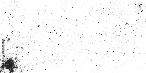 A close up view reveals a speckled grunge texture with dark scattered particles a predominantly white background creating visual noise