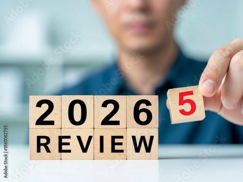 Business Review 2025 Turning Into 2026 on Wooden Blocks for Strategic Planning