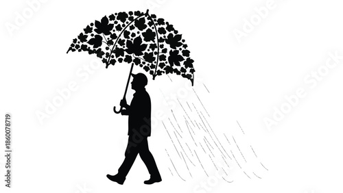 Man walking in silhouette under a leaf-shaped umbrella as rain falls