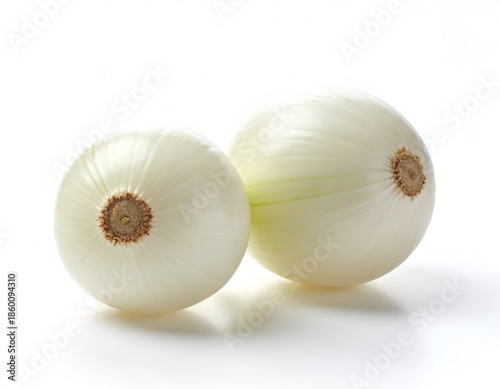 Two white globe-shaped vegetables on white background, studio shot