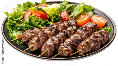 A plate of meat skewers and salad, isolated on a transparent background
