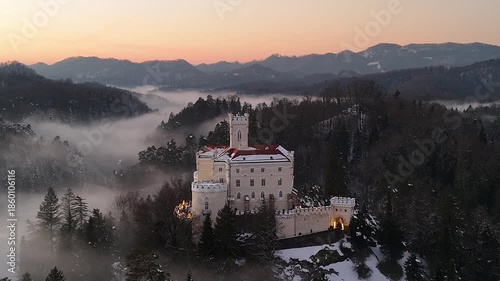 Aerial Golden Hour Winter Video of Trakošćan Castle, Snowy Castle at Sunset in Croatia