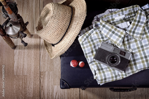 Travel theme still life with vintage items and fishing poles