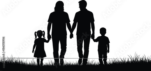 Silhouette of a happy gay male couple holding hands and walking in nature with their two young children during sunset