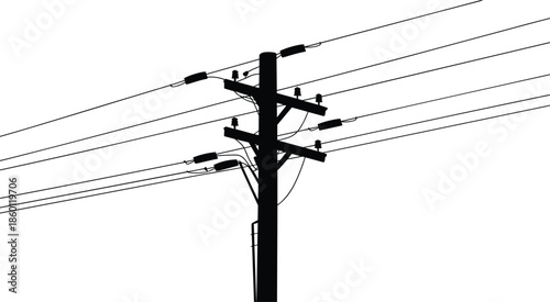 Silhouette of a wooden utility pole with multiple power lines and insulators Keywords: silhouette, utility pole, power line