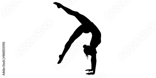 Silhouette of a woman performing a handstand with one leg raised