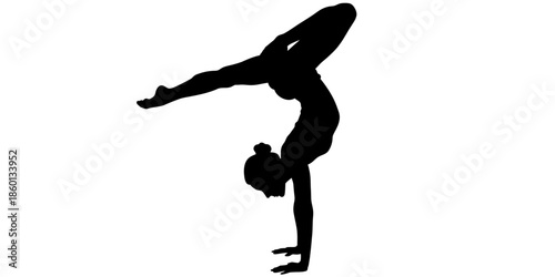 Silhouette of gymnast doing handstand with one leg extended