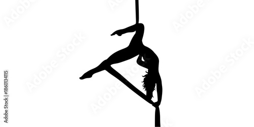 Silhouette of woman performing dynamic pole dance move
