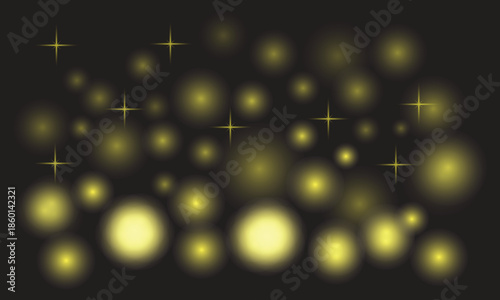 Glowing yellow lights on dark background with sparkling effects