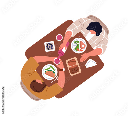 Couple eating and drinking, having dinner, meal. People sitting at dining tab...
