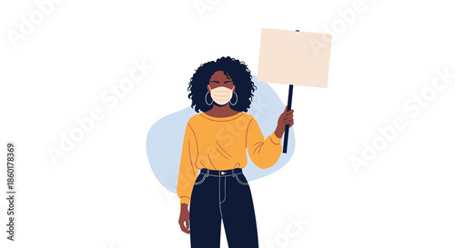African American woman with curly hair is wearing a protective face mask and holding a blank sign while participating in a protest.