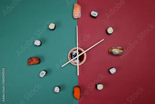 sushi chopsticks hour minutes hand mini sauce bowl rotating on green red paper clock watch time
