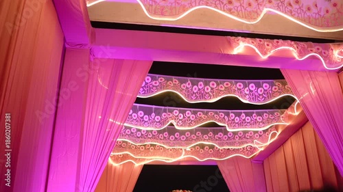 Beautifully decorated wedding venue featuring elegant floral arrangements, soft ambient lighting, and luxurious table settings