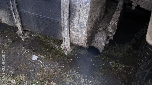 Smoke from the exhaust pipe of an old diesel truck, ecology. Environmental pollution.