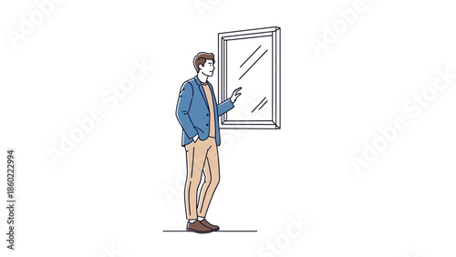Modern young man standing and using smartphone while looking at a mirror in a minimalistic