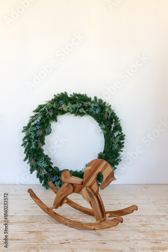 A big beautiful Christmas tree decorated with beautiful shiny balls and lots of different gifts laid out underneath it.