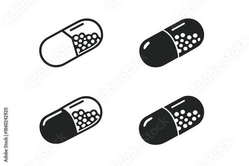 Four dark grey capsules with rounded ends on a dark background.