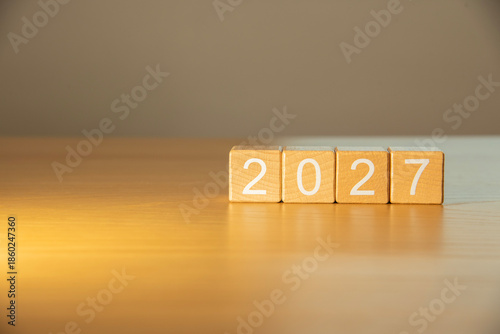 Craft wooden cube blocks 2027. Numbers on wooden blocks with copy space. 2027 happy new year idea concept.