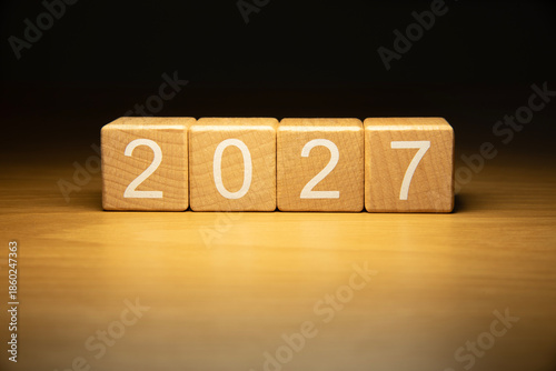 Craft wooden cube blocks 2027. Numbers on wooden blocks with copy space. 2027 happy new year idea concept.