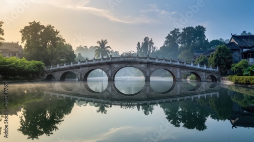 Serene bridge over calm waters at dawn
