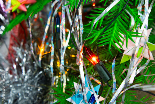 Origami Star Ornament on a Decorated Christmas Tree