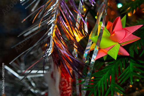 Origami Star Ornament on a Decorated Christmas Tree