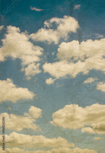 Vintage background in the blue sky with clouds