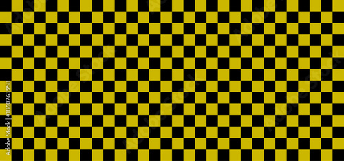 Checkerboard with very small squares. Black and yellow colors of checkerboard. Chessboard, checkerboard texture. Squares pattern. Background. Repeatable texture