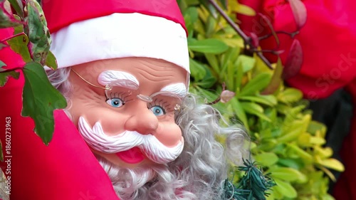 Santa Claus Face Beside Decorated Christmas Tree
