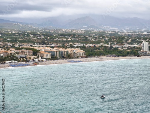 Peaceful coastal scene, Calm waters with distant mountains