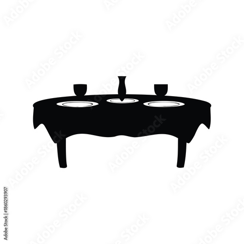 Black and white table set with plates, glasses, and a vase