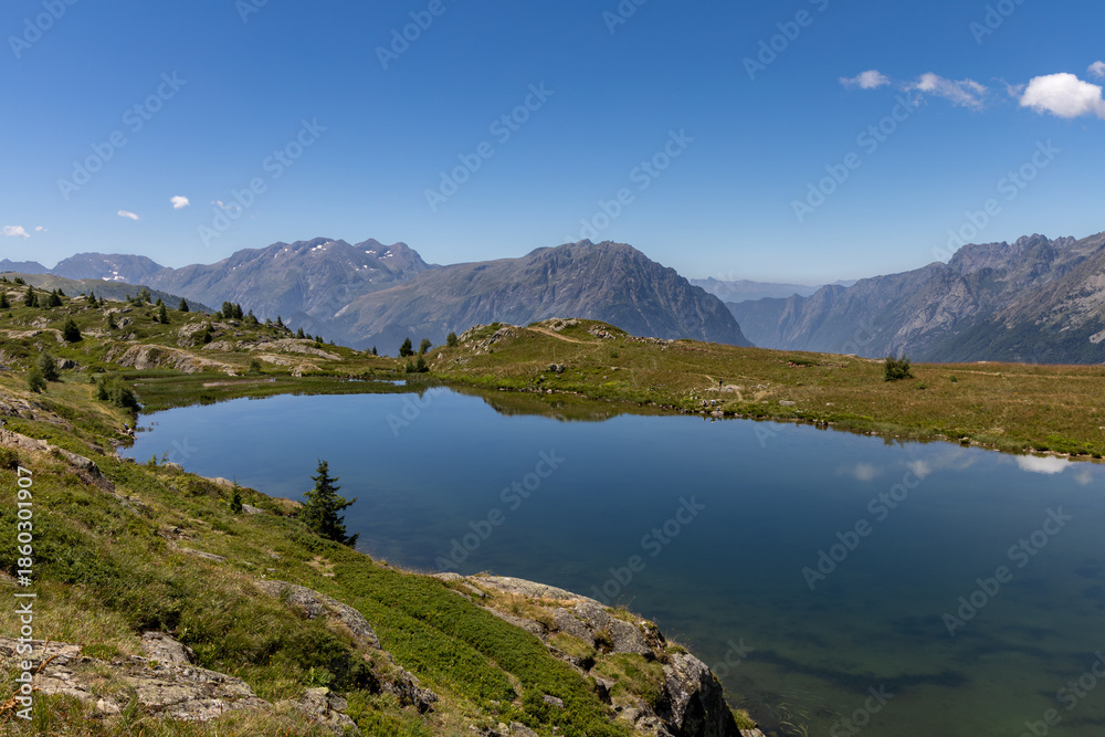 Naklejka premium Scenic Lake Besson in the French Alps, located northeast of Alpe d’Huez in the Grandes Rousses massif