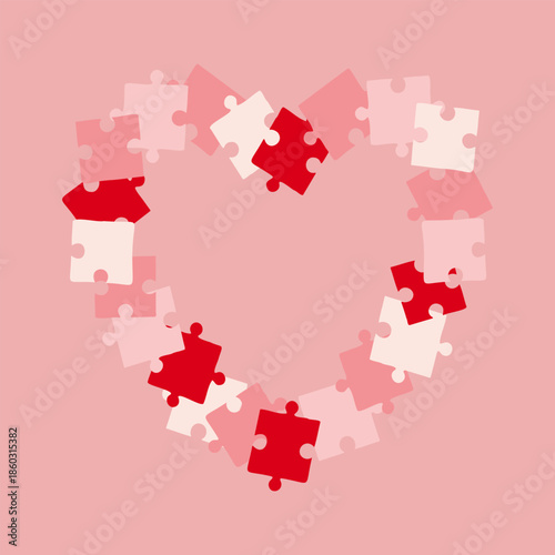Heart shaped frame made of pink puzzle pieces, a card for congratulating someone on Valentines Day, birthday, or declaration of love and passion. On soft pink background.