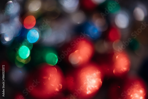 Photos with blurred lights of New Year's balls, creating a bright and festive atmosphere.