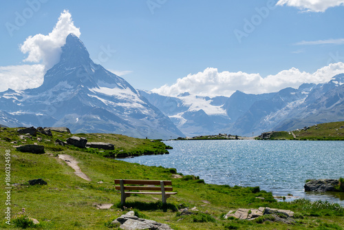 View of the Matterhorn with a bench from the Stellisee