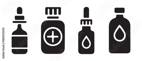 Set of various medicine and liquid dropper bottles isolated on white background.