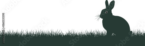 Easter day silhouette of a rabbit in a field on a bright background