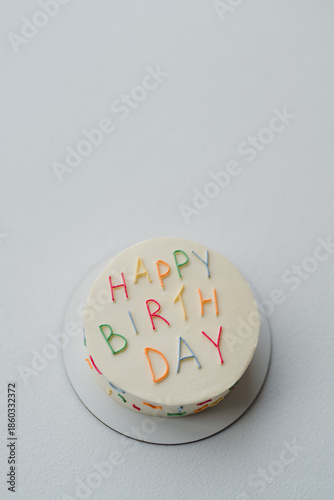 Stylish modern birthday cake. Beautiful delicious colorful dessert for a child party celebration.