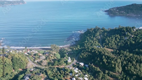 Wallpaper Mural Forward drone aerial of Niebla coastal peninsula with lush forest, village houses, Pacific Ocean bay, and distant islands panorama Torontodigital.ca