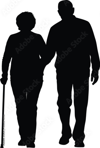 Elderly couple walking together in silhouette