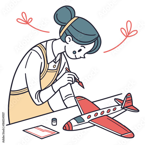 Woman painting a model airplane