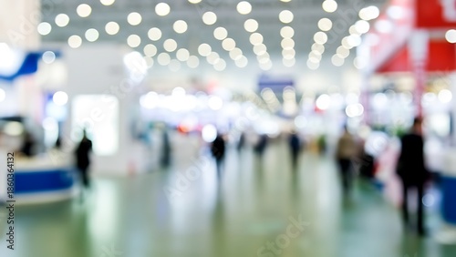 Wallpaper Mural Blurred exhibition hall at a trade show with bokeh ceiling lights and silhouetted attendees Torontodigital.ca