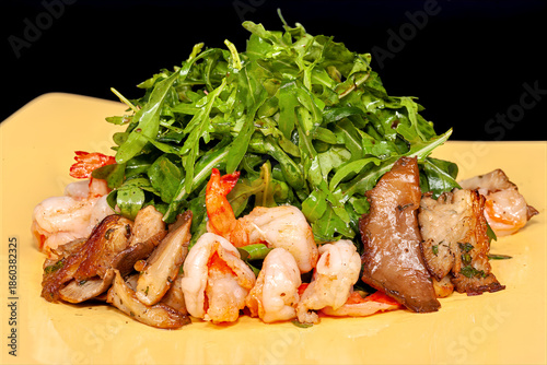 Salad with fried shrimp, mushrooms and lots of fresh arugula.