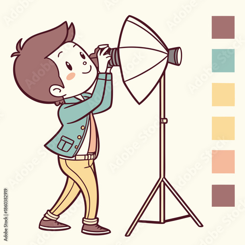 Young boy taking photos with studio lighting equipment